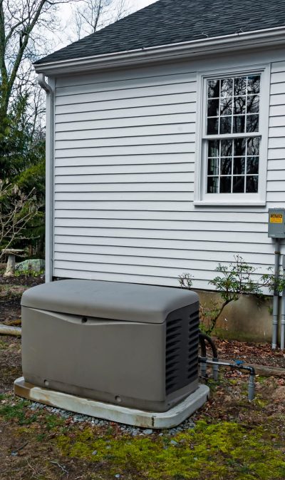 Residential standby generator on a concrete pad